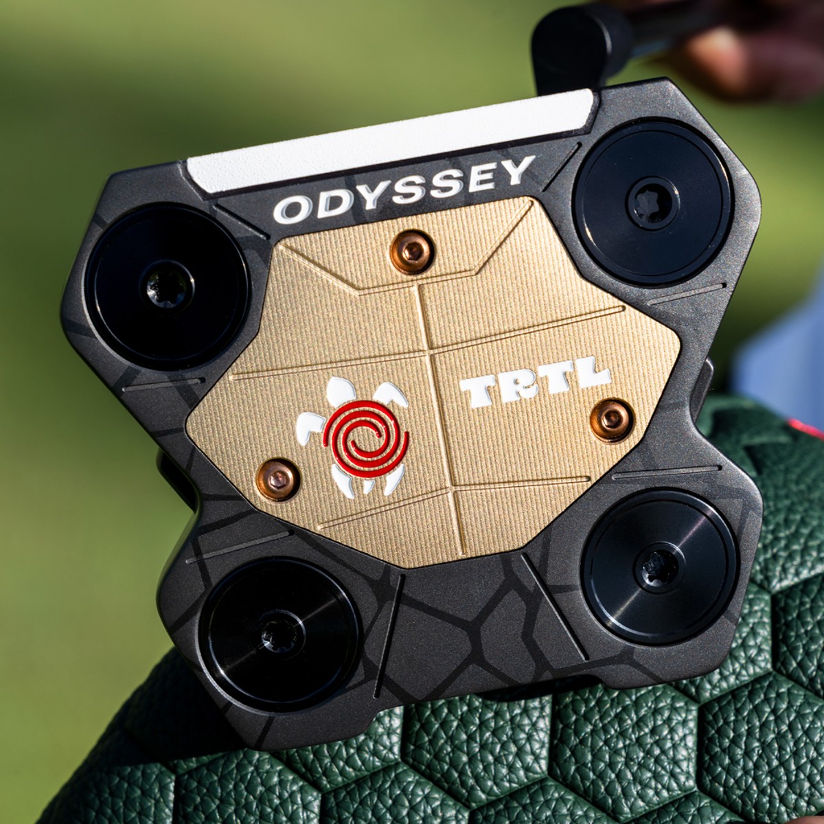 Sole of the Odyssey TRTL showing the gold aluminium sole plate and four corner weights